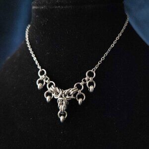 Gothic silver V shaped crown necklace with a small silver chain